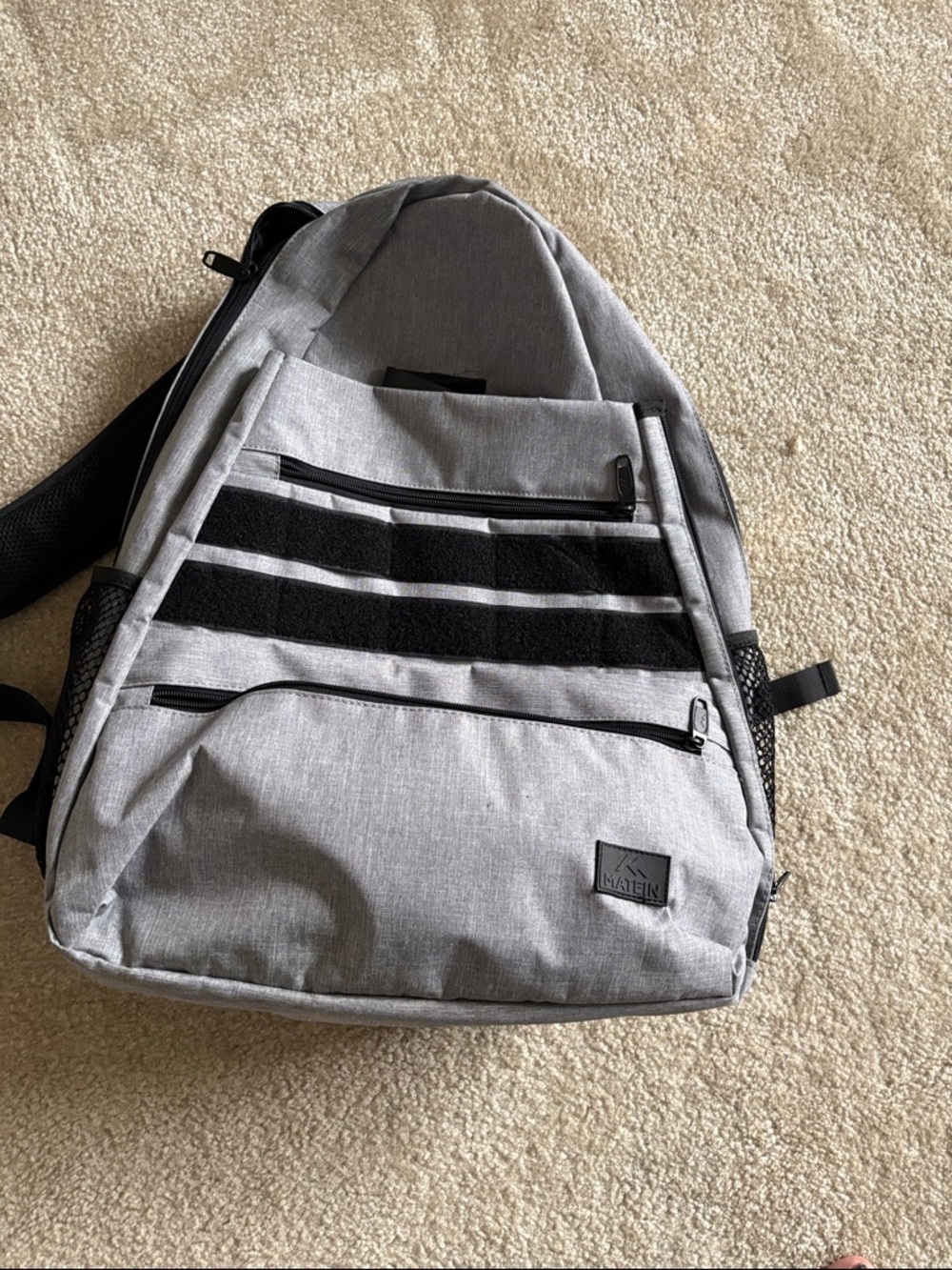 Gray tennis or racket ball backpack